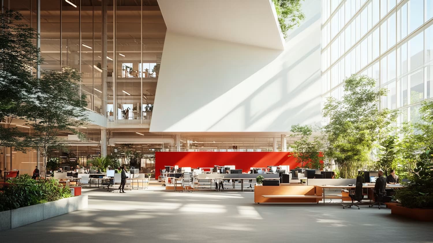 Un atrium de bureaux lumineux et végétalisé, entre plusieurs plateaux de travail